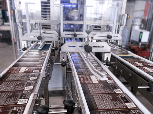 Ligne d’encaissage de tablettes de chocolat avec système de stockage des tablettes Ixapack