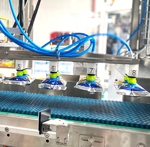Module de chargement pour doypacks de jus de fruits Ixapack