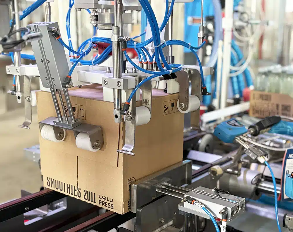 module de coiffe robotisé pour machine de conditionnement automatique